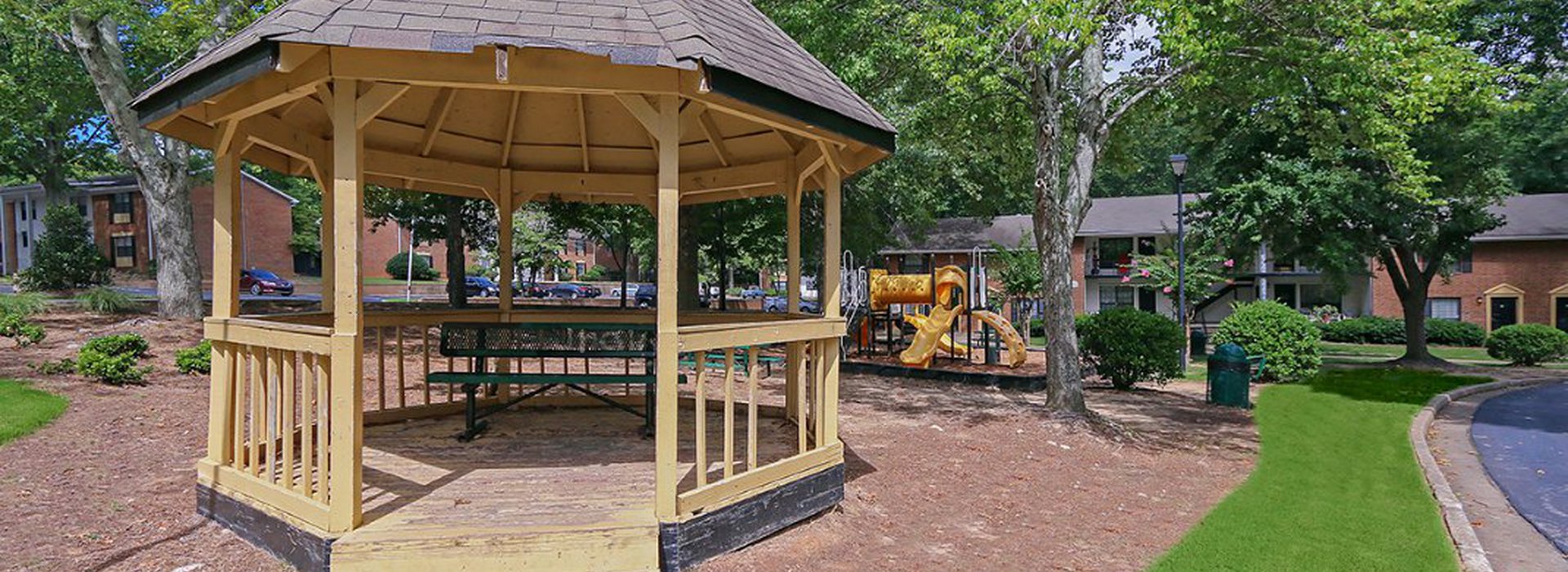 space for recreation of children with green trees providing shade.