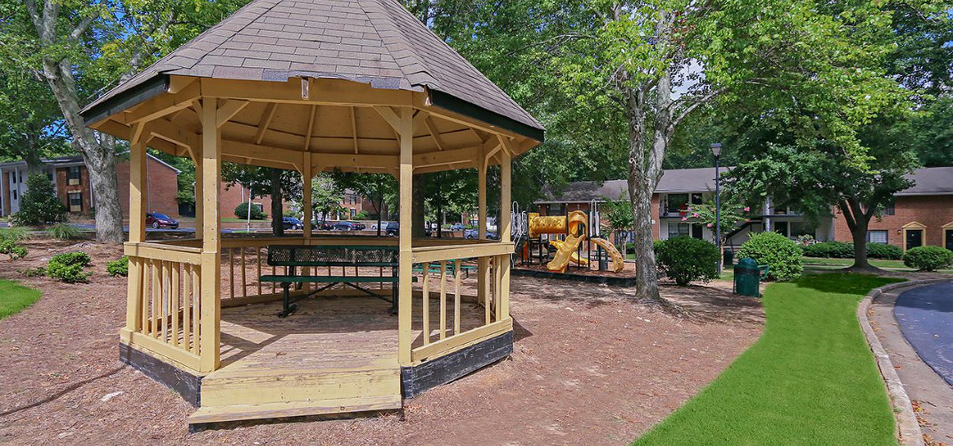 space for recreation of children with green trees providing shade.